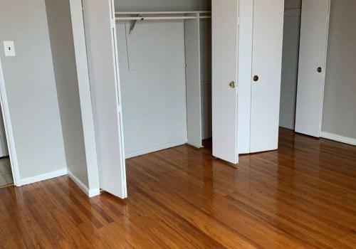 Longwood Manor closet with hardwood floor