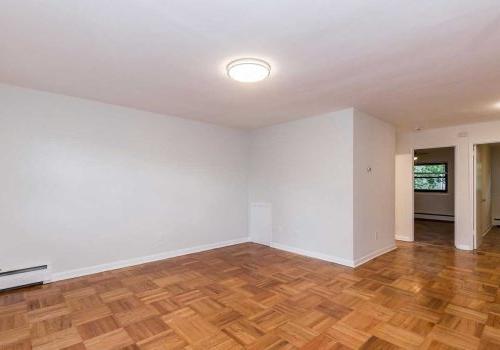 Open concept living and dining room with hardwood floors at Sedgwick Terrace apartments for rent.