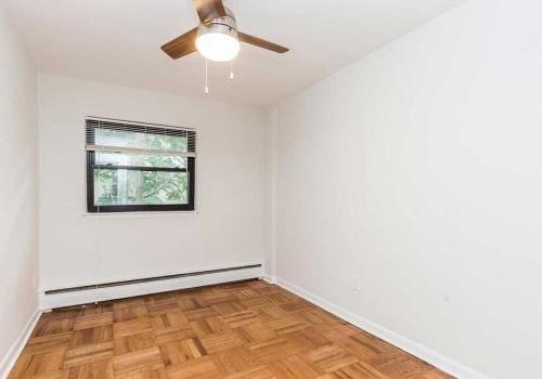 Bedroom with hardwood floors and window lighting at Sedgwick Terrace apartments for rent